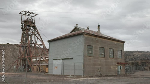 pan of a headframe and derelict building at a historic mine in broken hill of western nsw, australia photo