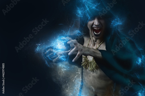Dark sorcerer casting a magic spell with an animal skull