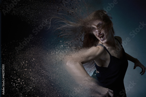 Fotografie Halloween horror, woman dispersing and dematerializing, screaming in agony, disa