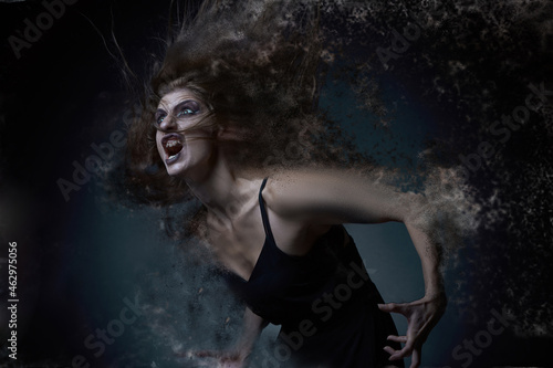 Halloween horror, woman dispersing and dematerializing, screaming in agony, disappearing