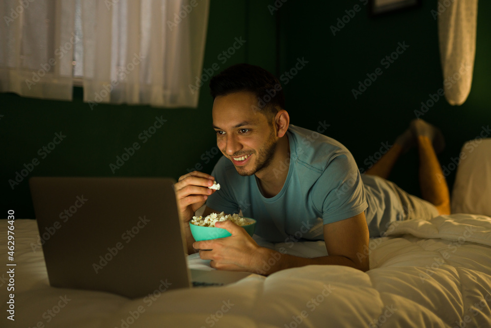 Attractive man enjoying a fun movie Attractive man enjoying a fun movie