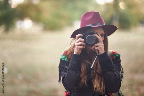 Woman photographer holding a dslr camera