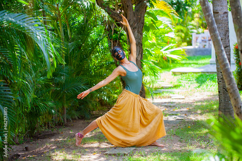 Indigenes woman performing a magical dance with a painted face photo