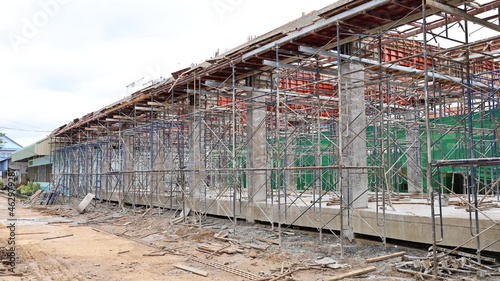 Metal scaffolding. Steel scaffolding is a temporary structure to support the building structure during construction and as a platform for workers to work. selective focus photo