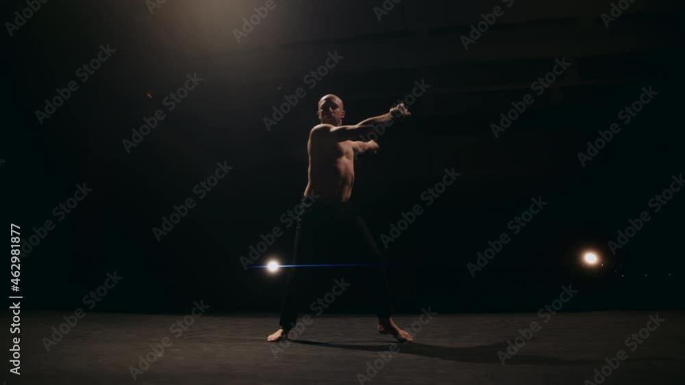 A ballet male dancer is performing choreography on classic theater stage. Choreographer is practicing dance moves. Acrobatic elements of contemporary dance. Performance concept. 4k footage. A ballet male dancer is performing choreography on classic theater stage. Choreographer is practicing dance moves. Acrobatic elements of contemporary dance. Performance concept. 4k footage.