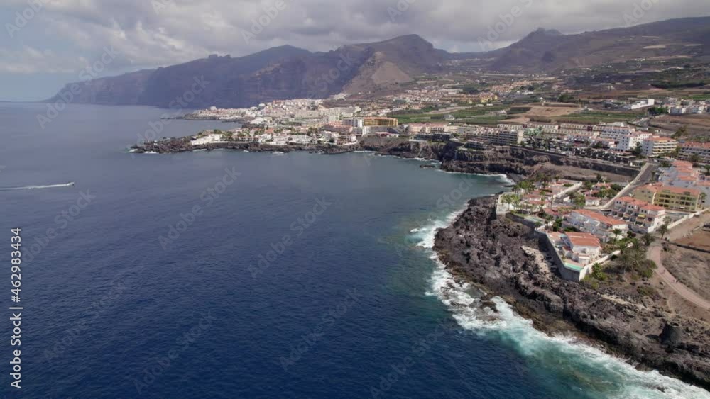 La Arena Coastal Neighborhood, Los Gigantes Tenerife, Spain. Aerial View, Scenic Coastline and Buildings by Atlantic Ocean, Drone Shot La Arena Coastal Neighborhood, Los Gigantes Tenerife, Spain. Aerial View, Scenic Coastline and Buildings by Atlantic Ocean, Drone Shot