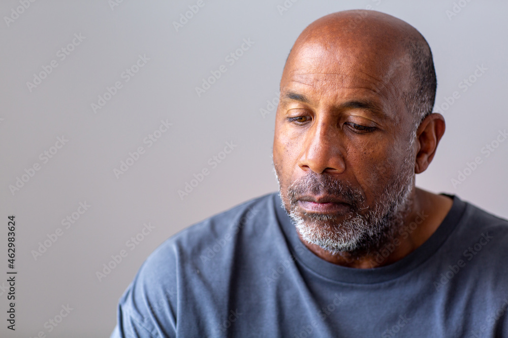 Portrait of a mature man looking sad and away from the camera. Portrait of a mature man looking sad and away from the camera.