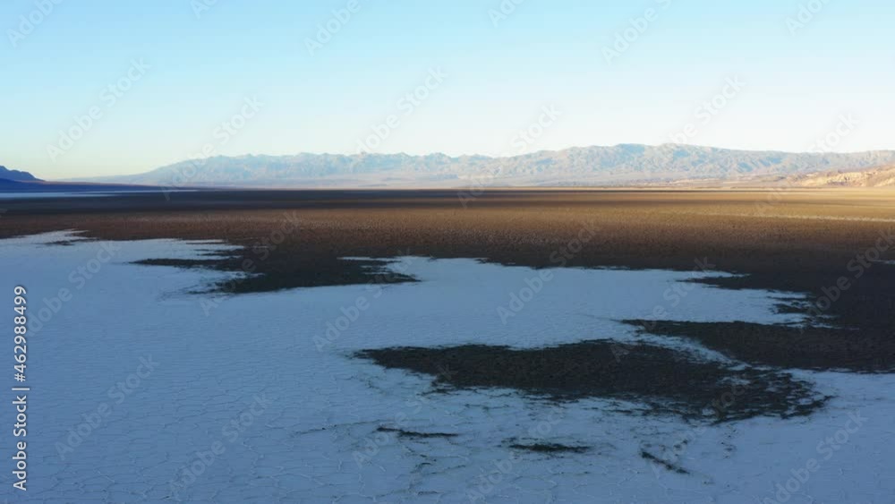 Birds eye view of Badwater basin at Death Valley National Park, covered with thick layer of salt pan. Aerial. Birds eye view of Badwater basin at Death Valley National Park, covered with thick layer of salt pan. Aerial.
