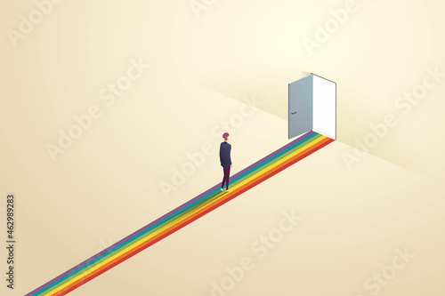 Young man was walking out the light through the door. There is a rainbow of light.