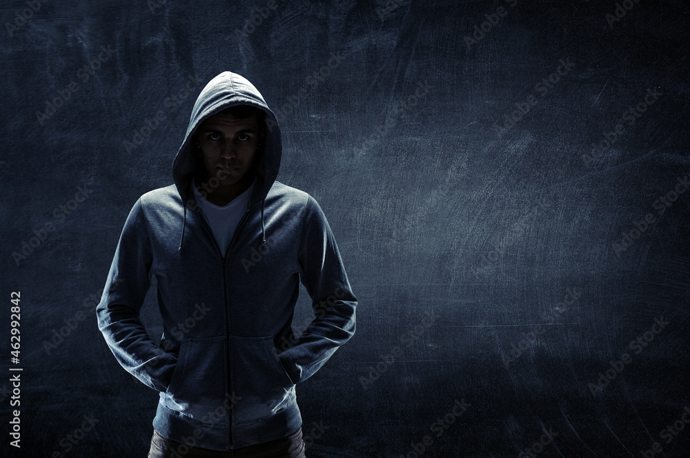 Silhouette of man in hoody Silhouette of man in hoody
