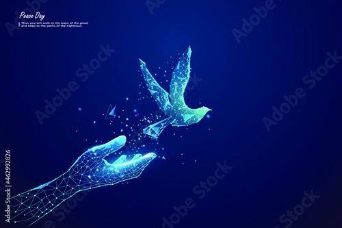 hand with flying bird. Low poly style design. Isolated vector illustration.