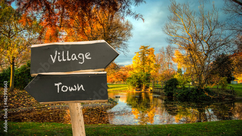 Street Sign to Village versus Town