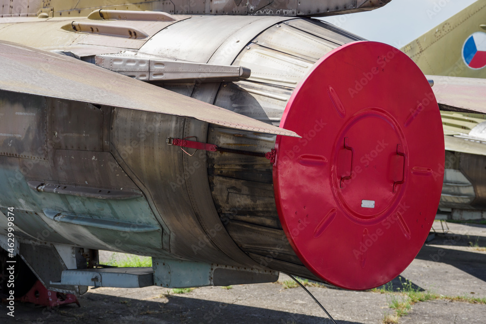 Red circular metal cover on a military fighter. Red circular metal cover on a military fighter.