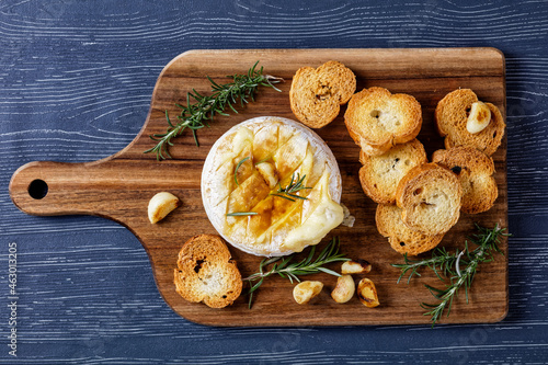 Baked camembert cheese with croutons, top view photo
