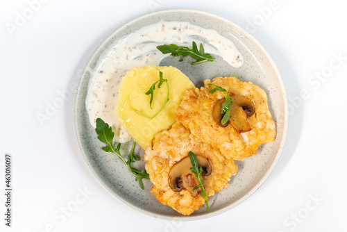 Chicken fritters with mashed potatoes on a white background top view