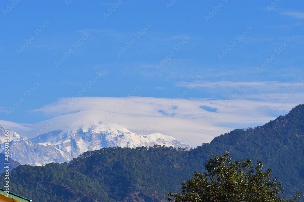 Fototapeta premium Panoramic Himalayan mountains view from Chandrashila summit, Chopta. Chandrashila is a peak in the Himalayan ranges in Uttarakhand state of India. It lies at an altitude of 12,083 ft from the sea