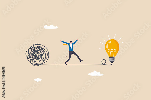 Simplify idea to find solution, thinking process or creativity to solve problem, discover easy way to understand concept, smart businessman walking away from mess chaos line to simple lightbulb idea. photo