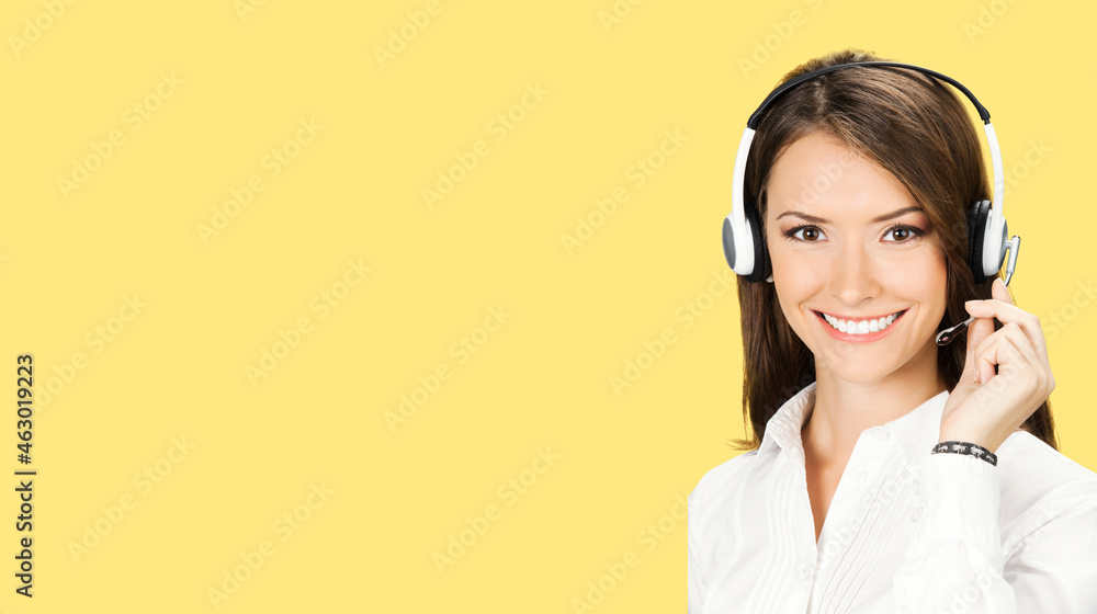 Call Center Service. Face portrait image of customer support or answer worker, sales agent. Caller, receptionist phone female operator. Helpline answering and telemarketing. Yellow color background. Call Center Service. Face portrait image of customer support or answer worker, sales agent. Caller, receptionist phone female operator. Helpline answering and telemarketing. Yellow color background.