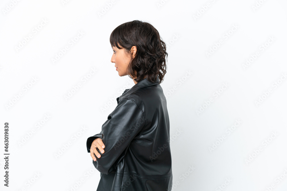 Young mixed race woman isolated on white background in lateral position