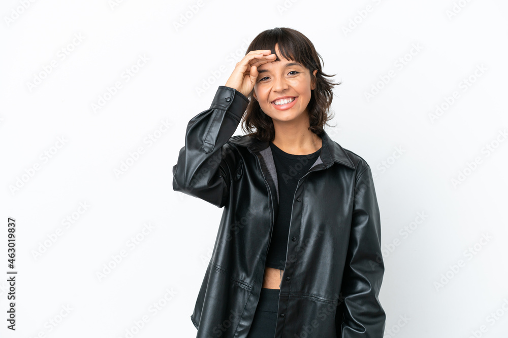 Young mixed race woman isolated on white background saluting with hand with happy expression Young mixed race woman isolated on white background saluting with hand with happy expression