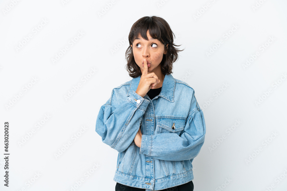Young mixed race woman isolated on white background showing a sign of silence gesture putting finger in mouth Young mixed race woman isolated on white background showing a sign of silence gesture putting finger in mouth