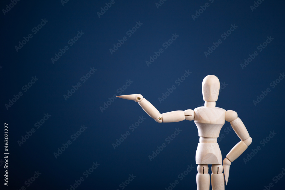 wooden man with hand up on blue background to hold up your banner wooden man with hand up on blue background to hold up your banner