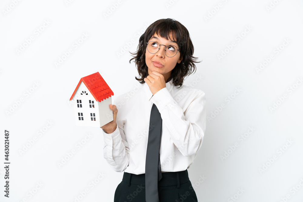 Real estate mixed race agent isolated on white background and looking up Real estate mixed race agent isolated on white background and looking up