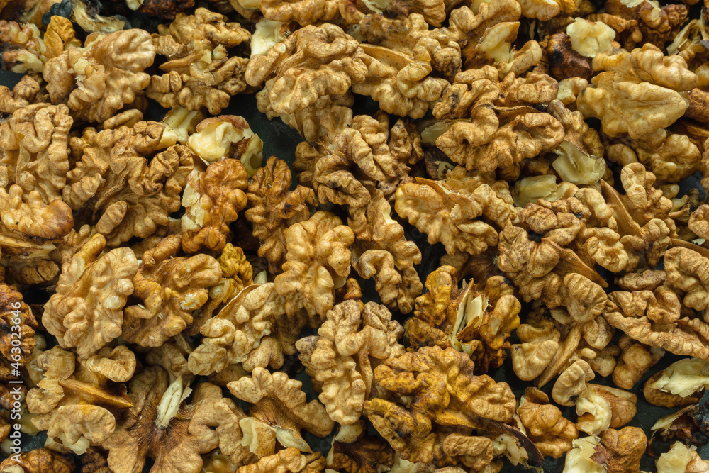 Top view of peeled walnuts. Close-up. Background image. Top view of peeled walnuts. Close-up. Background image.