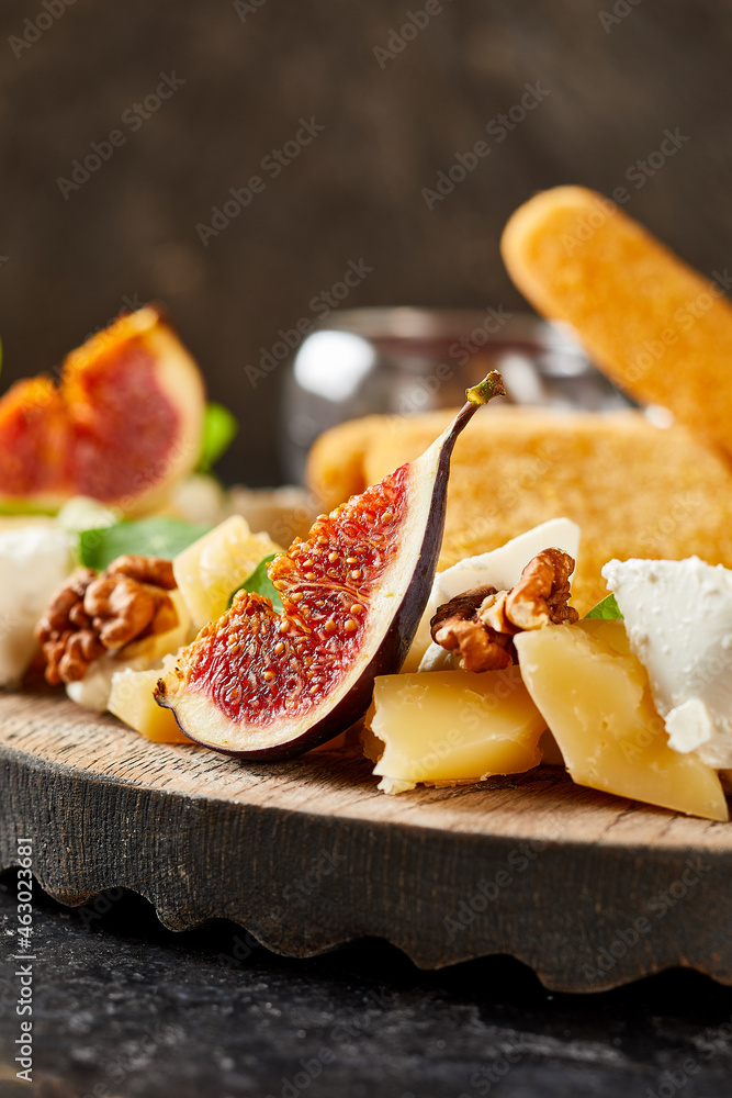 assortment of cheese and fruits with honey and red sauce assortment of cheese and fruits with honey and red sauce