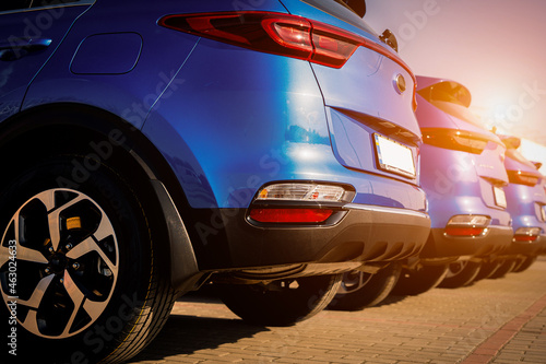 Blue business car with shiny front lights color bright