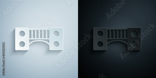 Paper cut Playground kids bridge icon isolated on grey and black background. Paper art style. Vector