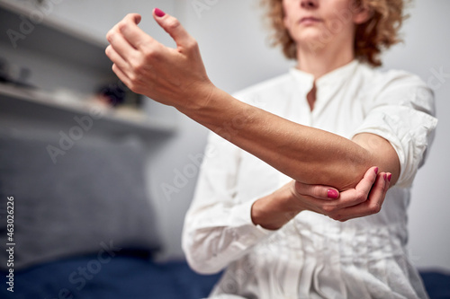 Woman with arm, elbow, wrist and ligament issues. © astrosystem