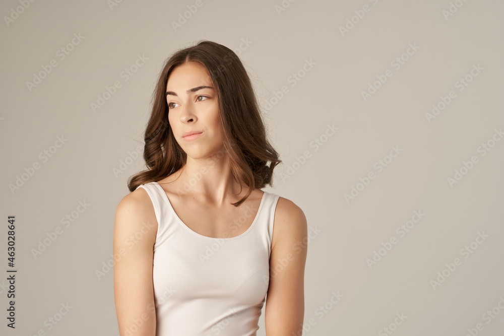 beautiful woman in a white t-shirt hair care Studio Lifestyle beautiful woman in a white t-shirt hair care Studio Lifestyle