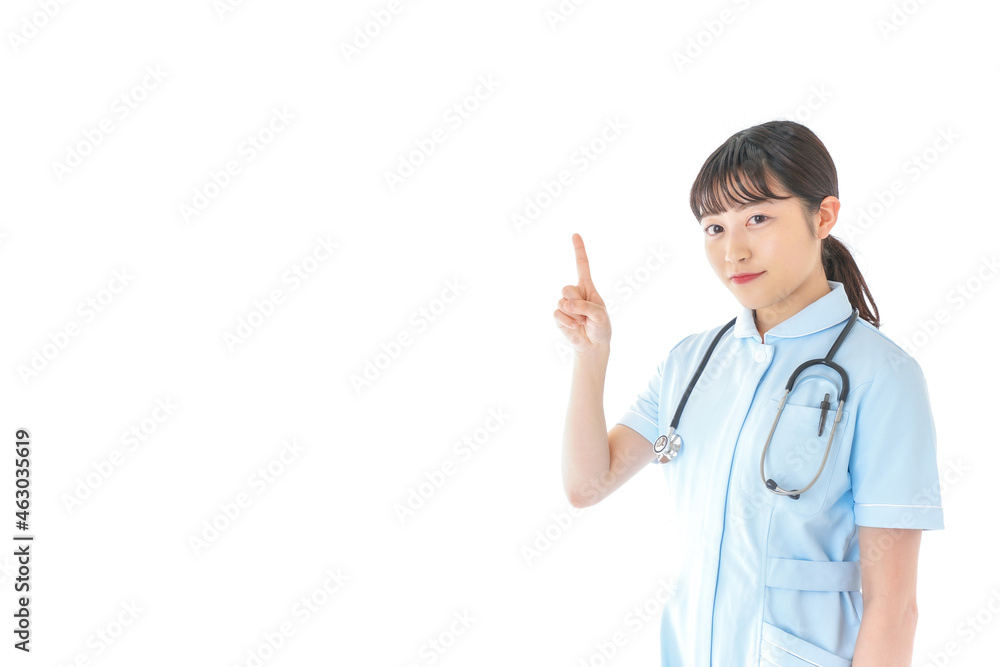 ポイントを指差す若い看護師 ポイントを指差す若い看護師