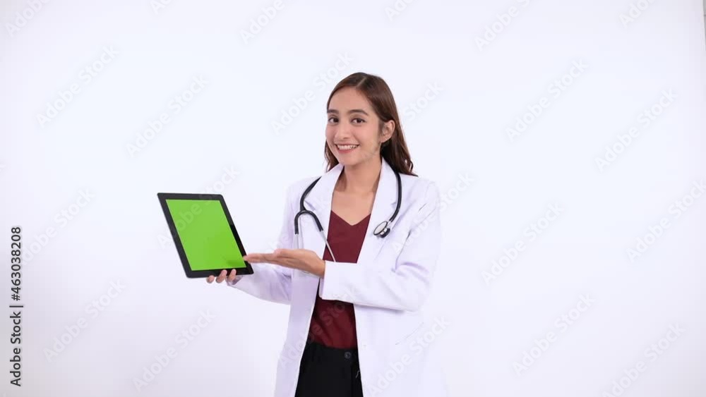 doctor smiles with a gesture showing the screen of a pad to the camera doctor smiles with a gesture showing the screen of a pad to the camera