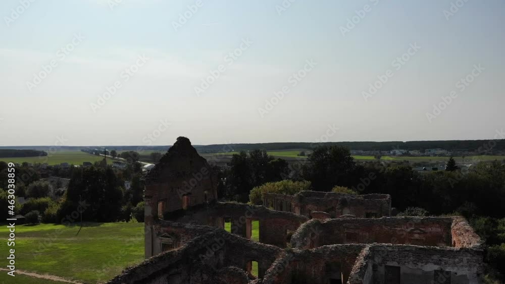 ruins of old ancient castle building in europe, shot from drone above, aerial archaelogy