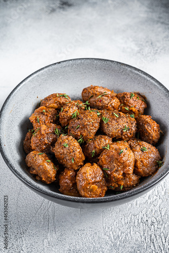 Fried Meatballs in tomato sauce from ground beef and pork meat. White background. Top view