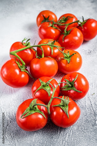 Fresh red tomatoes on kitchen table. White background. Top view