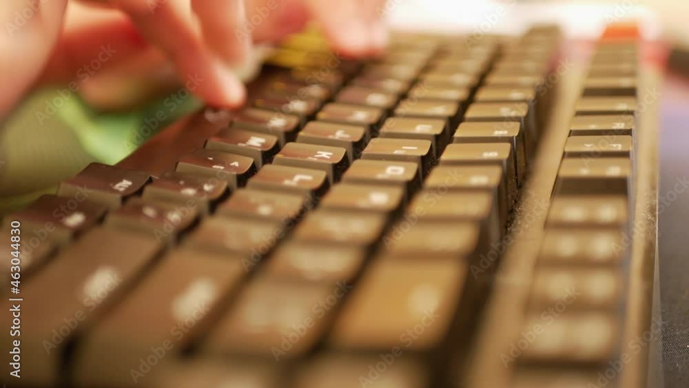 Typing Hands of a man in close up. blurred background Typing Hands of a man in close up. blurred background