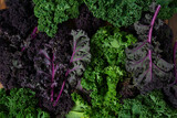 red and green kale on brown wooden surface