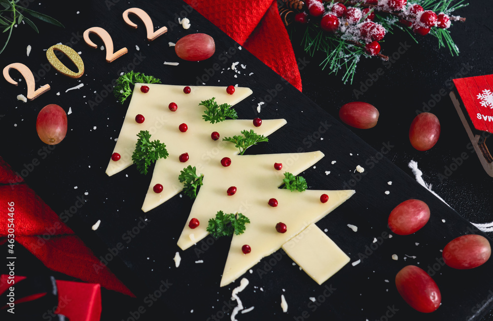 2022 Christmas Tree Cutting Creative Christmas Tree Made Of Cheese With Herbs, Spices, Grapes And  Numbers 2022 On A Cutting Board. Stock Photo | Adobe Stock