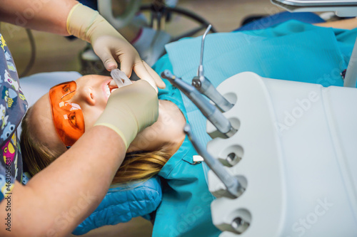 Woman having teeth examined at dentists. Dental treatment in dentistry. Appointment at the dentist. lifestyle, real life