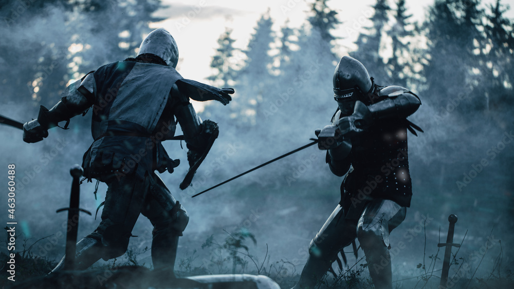 Dark Age Battlefield: Two Armored Medieval Knights Fighting with Swords. Battle of Armed Warrior Soldiers, Killing Enemy in Mysterious Forest. Cinematic Smoke, Mist, Light in Historic Reenactment - obrazy, fototapety, plakaty 
