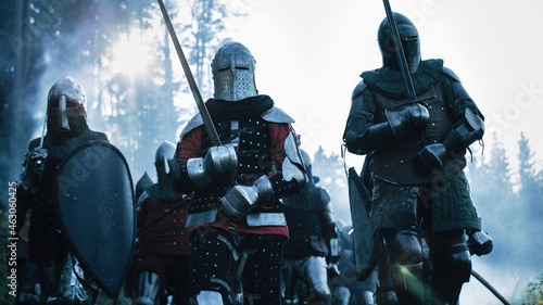 Epic Invading Army of Medieval Soldiers Marching on Battlefield, Armored Warriors with Swords. War, Battle, Conquest. Dramatic Historical Reenactment. Cinematic Action