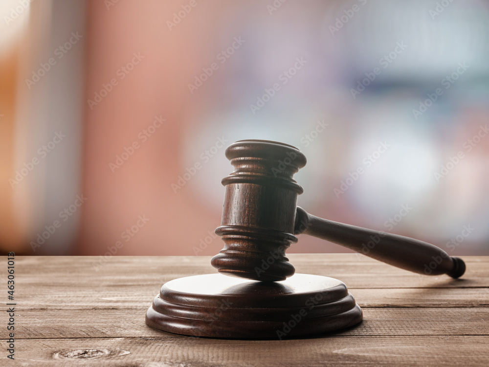 Judge's (auction) gavel on the table Judge's (auction) gavel on the table
