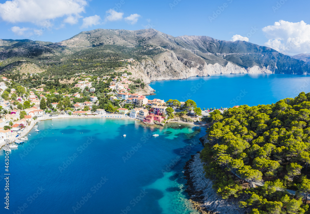 Assos picturesque fishing village from above, Kefalonia, Greece. erial drone view. Sailing boats moored in turquoise bay
