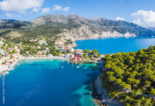 Assos picturesque fishing village from above, Kefalonia, Greece. erial drone view. Sailing boats moored in turquoise bay