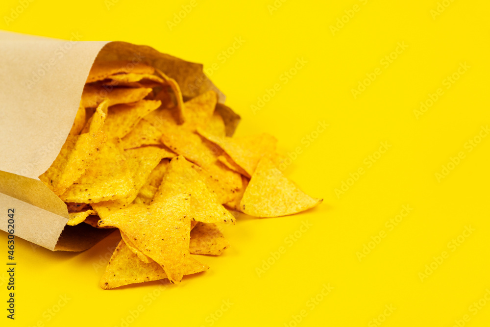 Crispy nachos chips in paper bag for convenience. Crispy nachos chips in paper bag for convenience.