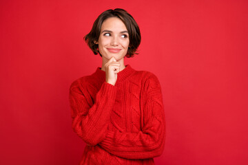 Photo portrait young woman smiling looking copyspace thoughtful isolated vibrant red color background