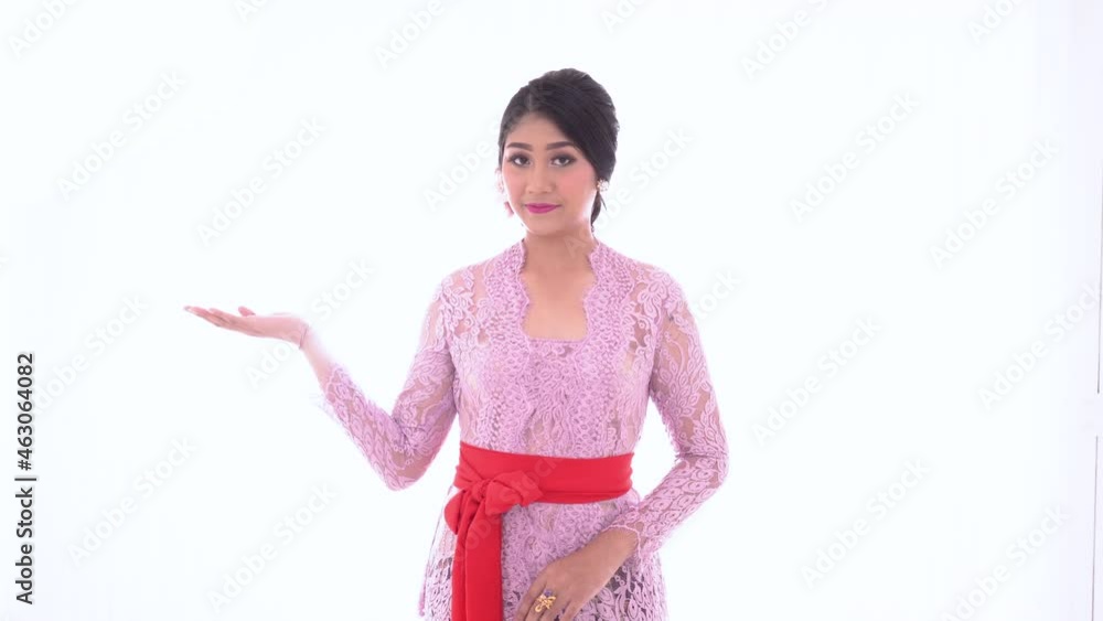 Young Balinese woman with presenting a product Young Balinese woman with presenting a product